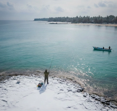 Clear winter water shore angler and boat fishing scene, showing how pike water clarity shapes winter pike fishing strategy