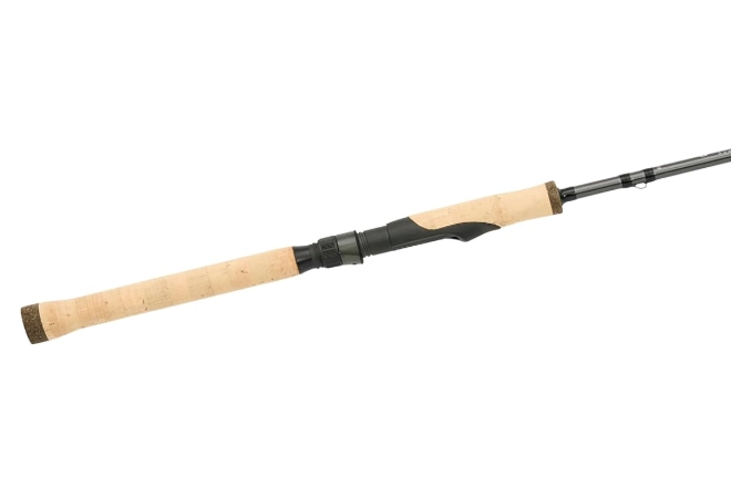St. Croix Avid spinning rod placed in a natural outdoor setting near the water showing strong build and premium finish