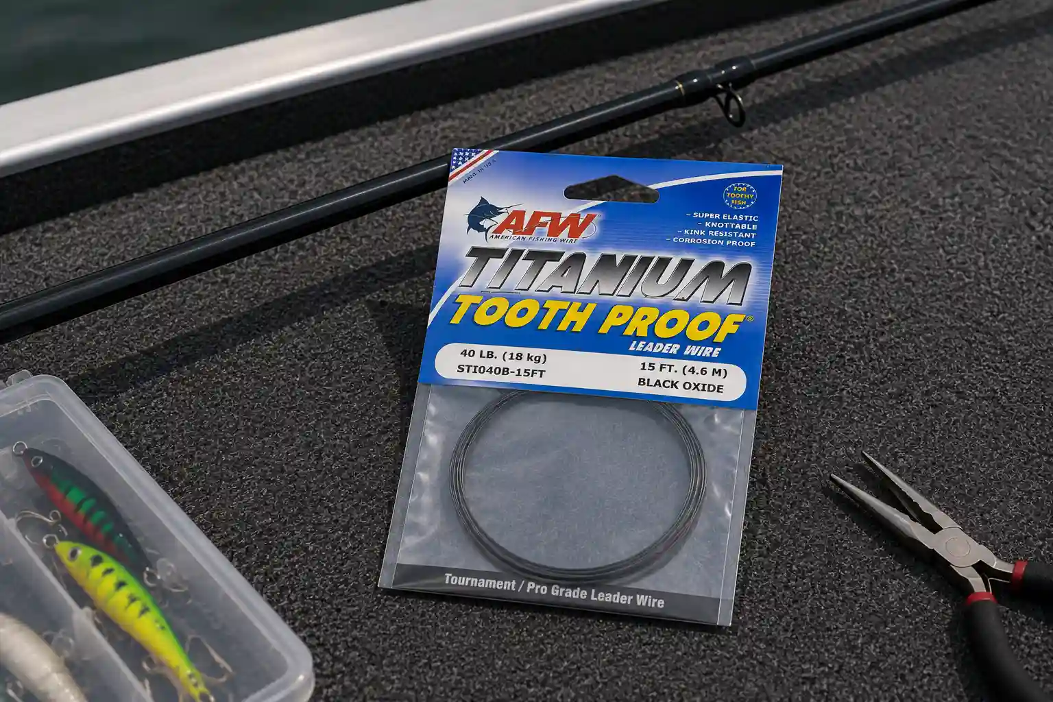 AFW Titanium Tooth Proof 40lb Black Oxide pike leader wire with jerkbaits and crimping pliers on boat deck