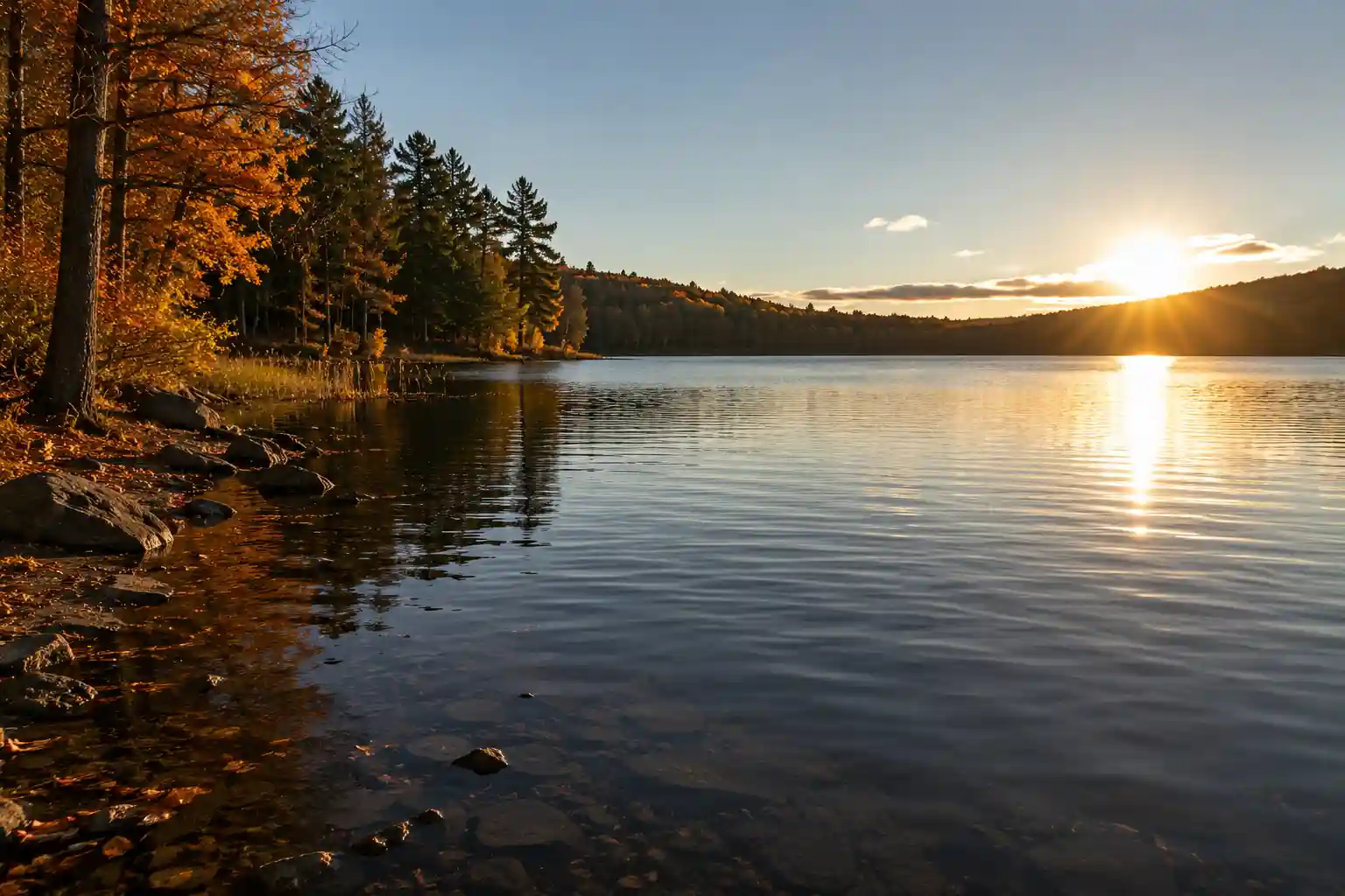 Low autumn sun over a lake during changing fall pike feeding conditions