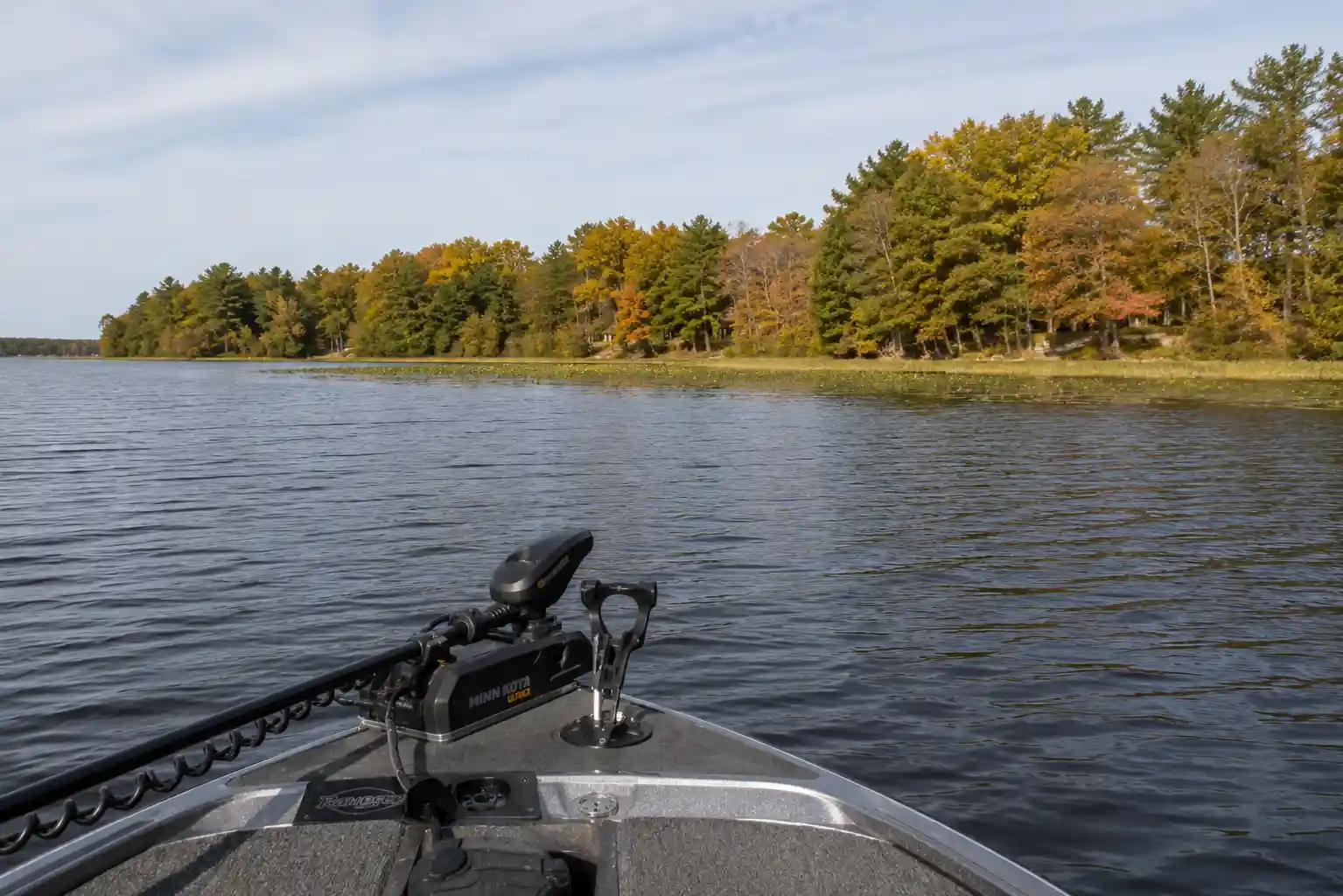 Boat positioned 20 to 30 meters outside the weed edge during early fall pike fishing