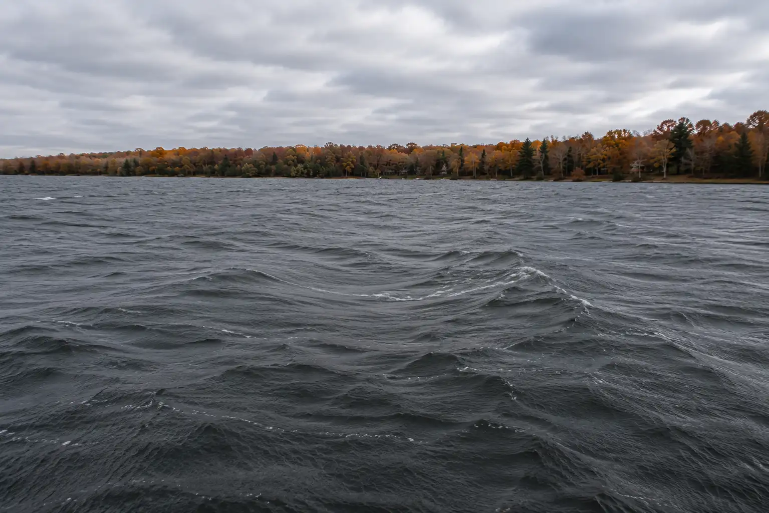 Choppy water from strong wind during fall pike fishing