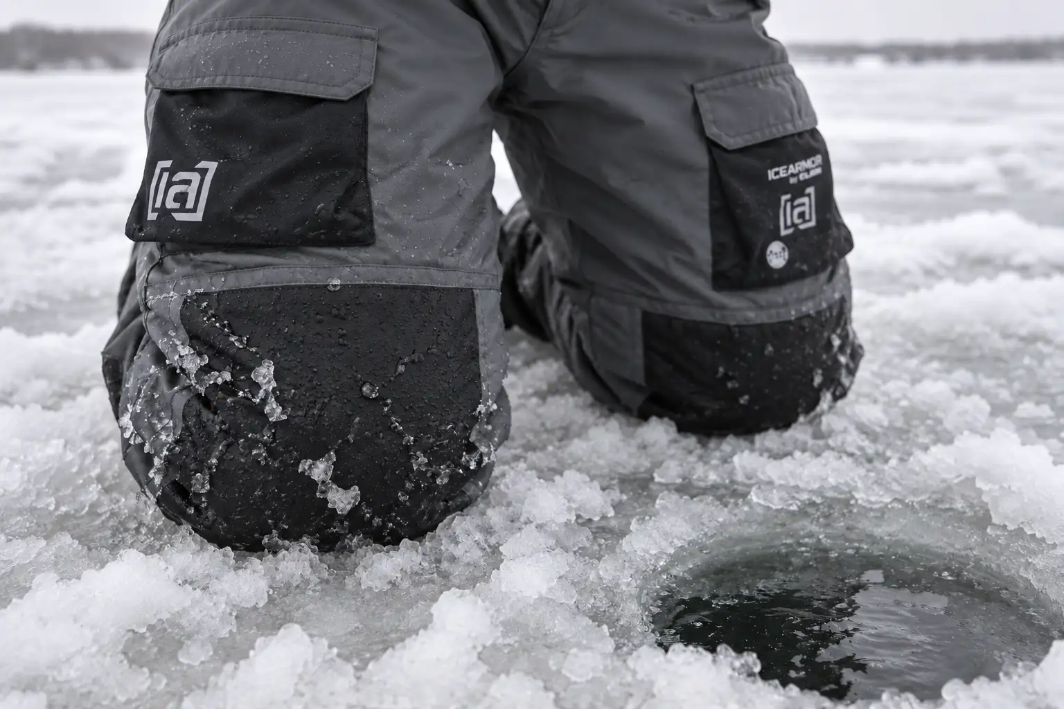MFG testing the IceArmor by Clam Ascent Float Bib knee panels while kneeling in wet slush beside an ice fishing hole